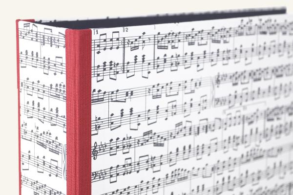 Folder with music motif with red edges and mechanism